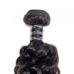 Bundles of 10-30 Inch Italy Curly Virgin Brazilian Hair #1B Natural Black with a label, displayed against a white background.