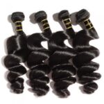 Six bundles of 10-30 Inch Loose Wavy Virgin Brazilian Hair #1B Natural Black laid out on a white background.